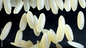 Discover the diverse shapes and textures of uncooked white rice. This overview focuses on the grain's features, illustrating its quality and types commonly used in cooking.