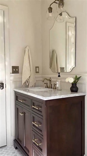 Bathroom vanity from Lowe’s! ✨ The value is so good! We swapped our builder grade vanity for this Lowe’s find, and it really transformed the bathroom. Real wood, a Carrara marble top, slow-close hinges & curved details give it that custom, timeless look! #lowespartner #bathroomvanity #bathroommakeover #bathroominspiration #homeimprovement | Angela Marie Made