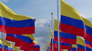 Colombia national flags waving in beautiful clouds. 3D rendering. Colombian national flags billowing from a flagpoles on a sunny day. Realistic flags blowing in the wind on beautiful sky.