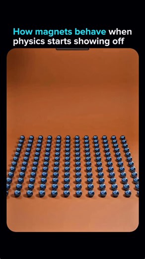 AIPulze | AI Tools & Technology on Instagram: "This isn’t CGI magic for the sake of it. It’s a physics driven magnet simulation that shows how each sphere reacts when a stronger block magnet enters the scene. Every tiny movement is the result of real magnetic force calculations pulling and pushing the grid into perfect chaotic order. It’s the kind of visual that looks simple until you remember the math underneath is doing all the heavy lifting. The best AI page to follow before 2025 ends 👉🏻 @a