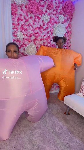 Inflatable Suit Fun: Hilarious Challenges in Pink and Orange