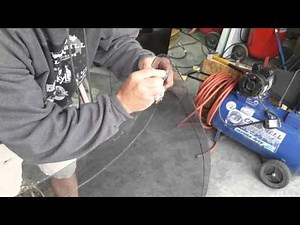 Cutting curved laminated glass