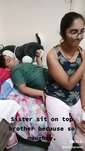 Sister Sitting on Brother Due to Naughty Behavior