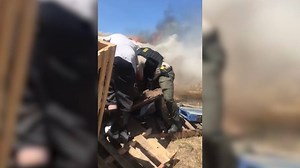 Quick thinking and bravery lead to this incredible rescue. John Phelps, along with the help of a sheriff’s deputy, pulled a man from his burning car as his wife, Corinna, filmed. 😱😱😱 | Hometown Tragedy
