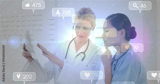 Doctor pointing tablet mentoring colleague in clinic, animated likes and comment counters emerging