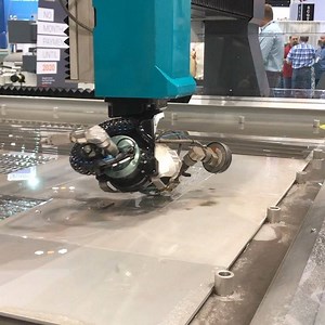 Watch the Dynamic Waterjet XD move! Flow’s Dynamic Waterjet XD provides faster, more accurate bevel cutting giving you the ultimate in speed and flexibility. #flowwaterjet #waterjetwednesday #shapethefuture | Flow Waterjet