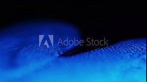 Neon blue liquid on surface, extreme close up Stock Video
