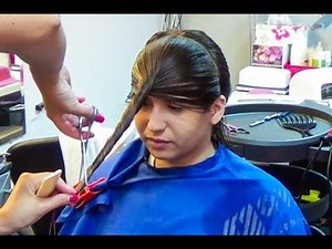 Nice woman getting a new style in long hair, now very layered and with bangs
