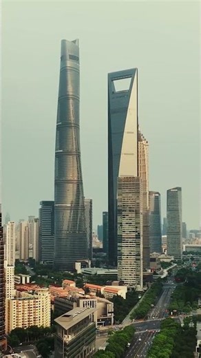 aerial drone close-up view of a modern skyscraper