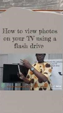 To view photos on your TV using a flash drive
