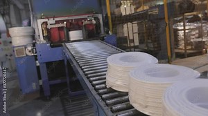 Packing reels with cable on a modern conveyor, automatic packing reels with cable, modern automated conveyor in a factory