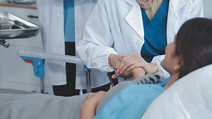 Download Doctor explaining report to patient in the hospital for free