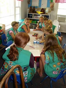 Junior Girl Scouts Volunteer In the Community