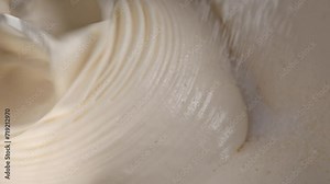 Pie dough kneading with automatic mixer closeup. Tasty bakery desert cake preparation with blender