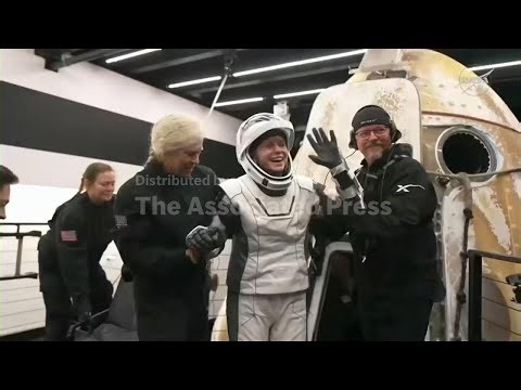 Astronauts exit Dragon space capsule after return to Earth
