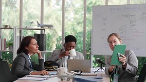 Young Employee Present Budget to Manager in Meeting of Airline Corporate