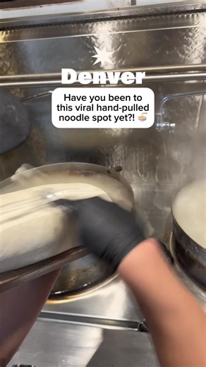Have you been to Denver’s newest hand-pulled noodle spot yet? 👀 If not, let us put you on to Noodles by Nina! They’ve quickly become one of our go-to spots, and honestly, their noodles have set a new standard for us. Yes, they’re that good. How could they not be when they’re hand-pulled and made fresh right in front of you? The glass kitchen is hands down the coolest part. Watching the chefs stretch and pull the dough to perfection is so fun. It’s basically a dinner and a show. Go show them som
