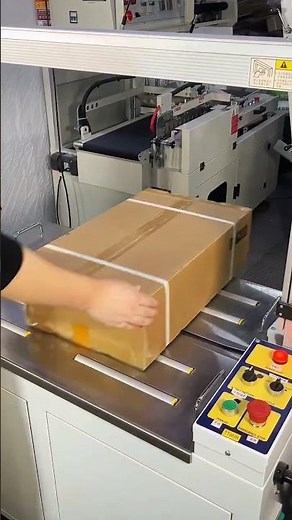 Fully automatic cardboard box strapping machine: simply place the box on the machine.