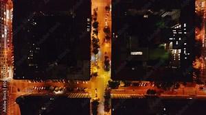 Cars are driving through the empty streets of Prague at night. Street lights illuminate the buildings and sidewalks below Stock Video