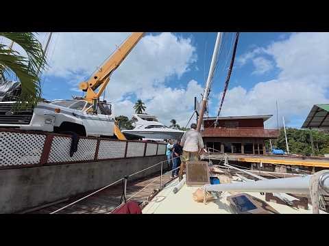 Skipjack Sailing 151: Abel's yard. Stepping the mast. Replaced sheaves at the top, plus other work.