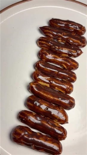 Eclair | Choux Pastry filled with Custard and dipped in Chocolate Sauce