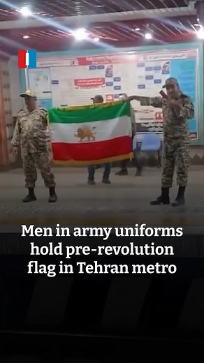 23K views · 392 reactions | A video circulating on social media appears to show two men wearing Iranian army uniforms holding up Iran’s pre-1979 Islamic revolution flag at a Tehran metro station. | Iran International - English | Facebook