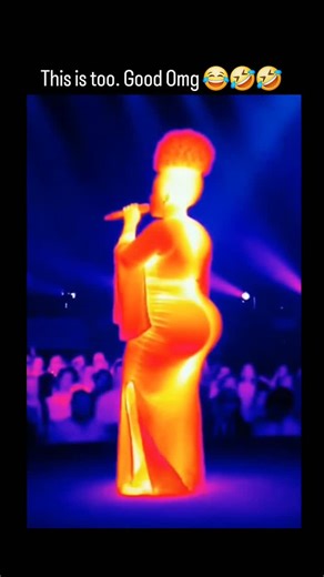 memelogist on Instagram: "The post shares a thermal imaging video of a performer in a flowing red dress singing on stage, with infrared hues revealing heat from the artist and audience amid blue-lit surroundings. This visual style uses infrared thermography to emphasize dynamic movement and energy, transforming a standard concert clip into an abstract, heat-map-like artwork that highlights human warmth against cooler elements. As the author's own recent upload with minimal engagement, it likely