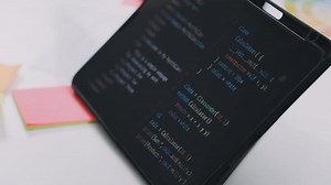 Download A tablet with a programming code on it for free