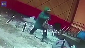 Elderly woman is knocked out cold by falling ice from roof