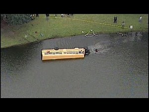 School bus crashes into pond