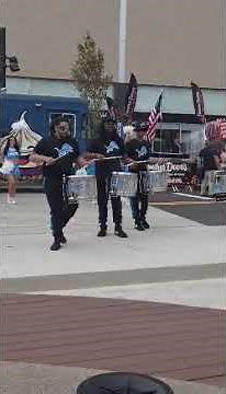 Detroit Lions drumline plays on the streets of Royal Oak during festival