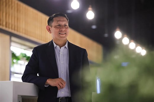 Singtel Singapore CEO flying the national flag high after bidding goodbye to corporate America