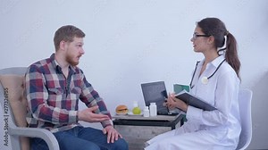 medic nutritionist helps to patient make diet plan and count calories for wellness and healthy weight using recommended nutritional supplements sitting in hospital office