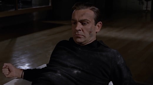 “This is gold Mr. Bond. All my life I’ve been in love with its colour, its brilliance, its divine heaviness.” 007 plays mind games to avoid disaster in GOLDFINGER. | James Bond 007