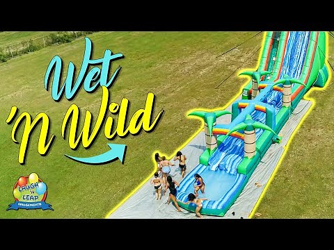 Wet n Wild Water Slide Fun - Girls having fun on a giant inflatable water slide