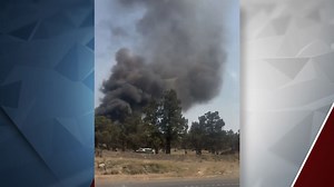 Crews contain apparent vehicle fire which broke out off Highway 97 in north Bend near the homeless encampment 'Dirt World'