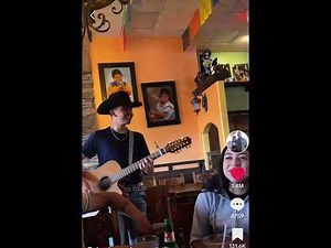 The girl's father asks the young man to sing a song to his daughter.