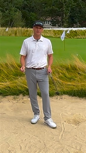Still struggling with those bunker shots? I see it every day - good players who tense up the moment they step in the sand. Most golfers focus too much on hitting the ball in bunkers. That’s exactly why they blade it across the green or leave it in the sand. Here’s a drill that will transform your sand game: 1. Place a tee in the sand and push it down until it’s completely flush with the surface 🏌️‍♂️ 2. Set your ball right on top of that buried tee. The goal isn’t to hit the ball - it’s to brea