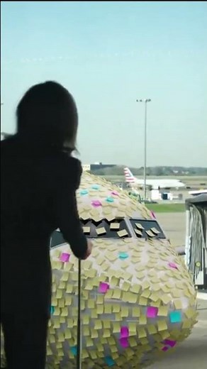 Plane at DFW Airport covered in sticky notes for April Fool's Day prank