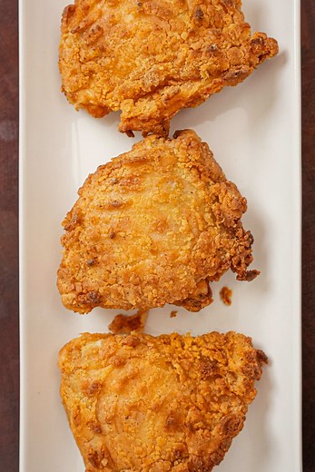 This is my secret to perfectly crispy and juicy Air Fryer Fried Chicken! The combo of buttermilk, hot sauce, and blend of spices seasons and tenderizes the chicken while the baking powder, flour, and starch crisp up beautifully without deep frying! Full recipe below! https://cjeatsrecipes.com/air-fryer-fried-chicken/ #cjeatsrecipes #friedchicken #airfryer #airfryerrecipes #easyrecipes