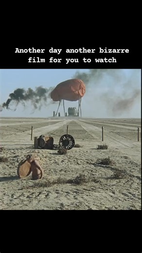 Kin-dza-dza! (1986) is a science fiction comedy film directed by Georgiy Daneliya. The film tells the story of two Earthlings who accidentally travel to the desert planet Pluk, where they encounter absurd hierarchies, meaningless rituals, and a bleak, dystopian society ruled by greed and cruelty. Daneliya blends biting humor with existential despair, using the desolate landscapes and grotesque characters to critique authoritarianism, apathy, and the absurdity of human behavior. Described as "Mad