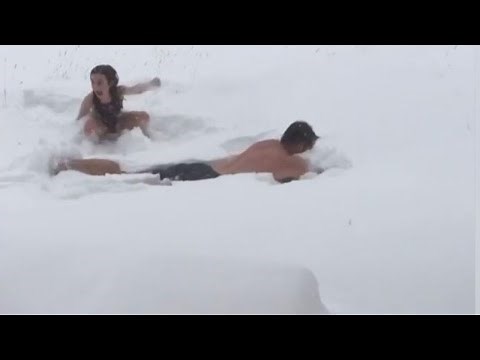 Father and Daughter Leave Hot Tub to Make Snow Angels in Bathing Suits