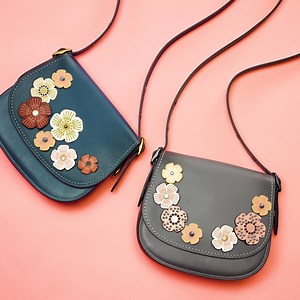 April showers bring May flowers. What does Coach Create bring? Our customization experience lets you design your own bag in store and online. https://on.coach.com/CustomizeIt | Coach