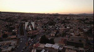 Goreme, Cappadocia, Turkey. The ancient city unfolds below, revealing its extraordinary charm with cave houses. Aerial view. Popular tourist destinations.