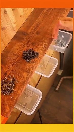 A wall-mounted bolt storage system using square plastic containers for neat,easy organization.