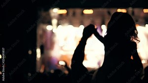 Young girl enjoys a rock concert. Public concert, no ticketing event