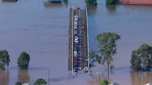 Australia floods: Residents and horses trapped on bridge overnight