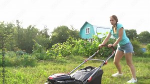 Lawn mover on green grass in modern garden. Machine for cutting lawns.