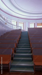 An empty lecture hall in a University. Interior of contemporary lecture theater in university campus Vertical video