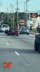 🚗 Aggressive Driving Incident in Spring Lake NC 🚦 A serious driving dispute was reported this afternoon along N Bragg Blvd heading southbound, just past Manchester Rd and Odell Rd in Spring Lake. Part of the encounter was captured on video, while earlier moments were shared by a witness. 👀 The witness stated that just before filming began, the driver of a red car stepped out at a stoplight holding a large object and approached the blue car behind him in a threatening manner. In an effort to g